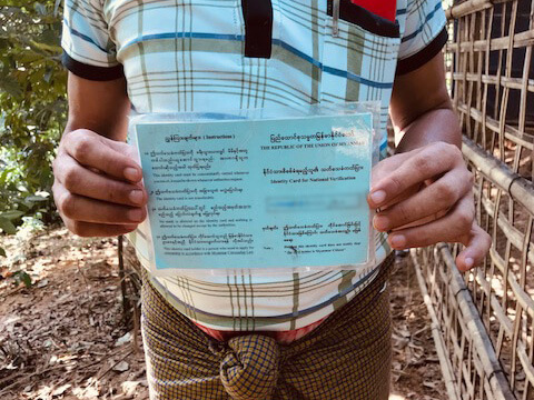 A Rohingya refugee man, 33, holds an NVC. Imprisoned in 2014 and forced to take the NVC upon his release, authorities beat and tortured him multiple times in detention. Upon his release he fled to Cox's Bazar District, Bangladesh. ©Fortify Rights, Cox’s Bazar, Bangladesh, 2019