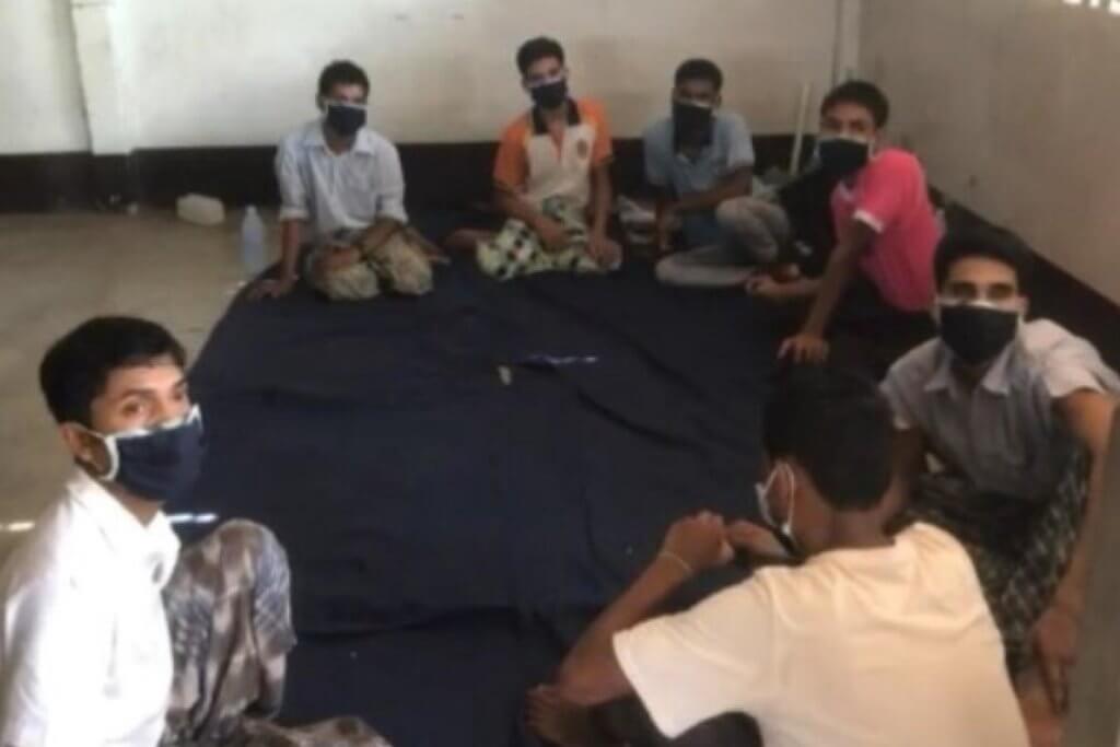 Rohingya survivors sitting together at the time of their arrest by Thai security forces on May 7, ©Siam Rath, 2020